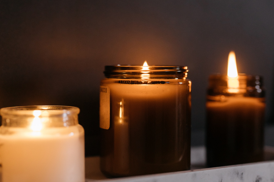 Lighted Candles in Glass Jars